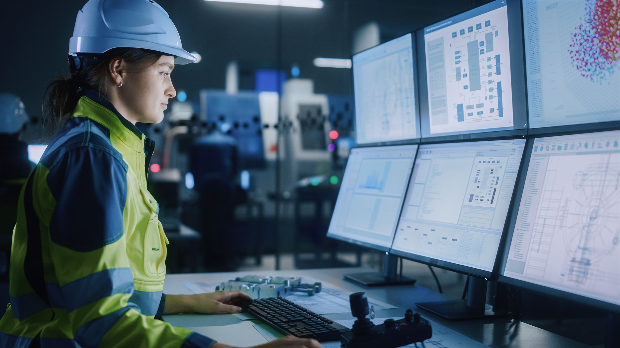 Woman-using-computer-in-factory